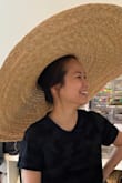 I love how ridiculously large this hat is to provide shade but my only qualm is the fit. It's too loose and slides around my head, can't seem to secure it. I am considering returning since I would have to stay still if I wear it for fear of it falling off. - Linda M.