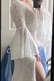 This dress looks much more expensive than it is. I am usually a L in Lulus and I could squeeze into an M (it was tight), so I'd say it runs a little large. Had a seamstress shorten the hem and the train about 6'. If I had to do it over again, I would have insisted on leaving the train long.   The thigh slit is HIGH, and if your dress is too snug in the hips, it will ride even higher. This poor dress was stretched within an inch of its life on me (no time to wait for a restock!) and when I sat down, it was almost up to my thigh crease. I had my dress bustled, but the simple fix was that I ended up carrying the hem over my arm for modesty. All that, with a dress too tight and I still looked AMAZING in it. - CE L.