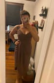 I bought this dress for a friend's cocktail wedding because I loved the style and color! I am an athletic build with a bigger bust so I always fall somewhere between a large and  medium. This dress is structured so it was tight around my rib cage but I was still able to breathe easily and move freely. I went with no bra and only Breast tape and felt totally secure! I do think I'm gonna go with using fabric tape on the skirt, because it does have a high slit when sitting down! I did have some struggles with the zipper, it took two of my friends to zip it up all the way. - Angela C.