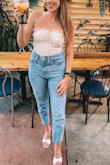Bought this top to wear for my birthday and luckily I was able to make it work! There isn't much stretch to the top and I wish they would've made it with a zipper. I was able to pull it on for my birthday but definitely recommend sizing up, I don't have a large bust and I think I could've done better with a medium! Other than the sizing, it's really cute! - Haley L.