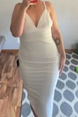 I purchased this dress for my wedding reception in September. I am so excited to wear it! Dress is very stretchy, lined, zipper in back is operational & not see through. My only complaint is when I adjust the straps, I don't necessarily like how they lay, however I plan on wearing my hair down. - Kristi H.