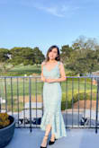 This is such a perfect dress!! It does feel a little tight around your thighs/hips when you sit but I don't recommend sizing up. It's such an elegant and beautiful dress and I love the way it fit me! - Raquel M.