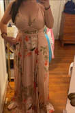 I usually wear a large but size down based on reviews, which was a good decision! I ordered a medium and would have needed to have it taken in and have the bust area tacked up to accommodate my larger ladies. The print and fabric are gorgeous, but for lack of a better word, the color was more of a nude than the pink it appears to be in pictures. Still a pretty color, but not right for my skin tone. I returned it, but think it will look great on others! - Cami R.