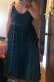 I am 5'8" and fluctuate between 195-200 pounds. I am kind of in-between sizes at the moment but I ordered a XL for this dress because of the material.  Although it did fit fine, it just looked a little baggy on me whereas on the model it looks night and tight around the chest and waist.  (apologies for the terrible quality photo. - Alison T.