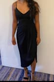 This dress is so flattering and forgiving! A little tighter in the bust area, I got away with wearing no bra. Be mindful of the slit in the front when you are walking it can fall very high. Overall really loved the dress and fit! - Gaby C.