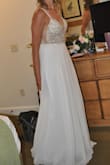 I was very very hesitant on ordering my wedding dress on line, but I am so glad I did!!! The dress was beautiful and fit great! I had to have an extra hook added to tighten it a little bit otherwise it was perfect. It was the perfect dress for our beach wedding without the high dollar amount I would have spent at a bridal store! Shipment was quick as well!! - Jessica P.