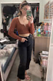 This shirt is super cute! Love the v wire in the front and the little puff on the shoulders. My only complaint is that it's a lot more cropped than it looks on the model. To be fair I do have a long torso but this shirt still only falls an in and a half below my bust. Must be worn with super high waisted jeans - Darian W.