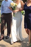 This was the best wedding dress for my intimate wedding. I wore smaller heels and needed about an inch hemmed and then had them sew the straps to the length I needed to get rid of the adjustable straps - I felt it made the dress look more expensive. Overall great support in the chest area, I wore petals and felt supported. Highly recommend this dress. - Hannah P.