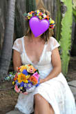 I love this dress so so much, it was so perfect for my casual courthouse wedding! I got TONS of compliments, and I felt so confident and beautiful. I ordered a S. It was SUPER long, but I got it hemmed. I also got it altered in the shoulders to sit better on my chest because of the low V cut. I am small breasted, so the amount of chest showing was fine for me! The back of the dress it absolutely stunning. I loved the lace, the shape and the buttons! Classic, simple, and elegant. I would buy this dress a million times over even if I had an unlimited budget! I highly recommend alterations to make the fit extra perfect for your specific body type. - Charisse M.