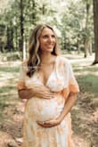Bought this dress for our maternity shoot. I sized up to a medium based on the other comments/reviews and the dress fit perfectly with a bump! I wore at 34 weeks about 160 lbs. The dress had a bit of stretch & super comfy. I'd say non maternity this dress would have been way too big. - Erika F.