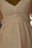 I wanted to love this dress but I really didn't. I ordered a small and it fit well, but it was loose in the chest area (it felt like I was going to fall out), the back didn't tie well enough, and the front part of the waist was bunching (see pic). Wouldn't order unless you have a big chest. - Delaney S.