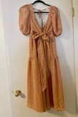 Everyone loved this. I bought a size down because I heard it ran large and it fit perfect. The color was more peachy than I thought it would be. Also you can tie the top in so many different ways! - Olive P.