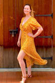 Gorgeous! I love wearing the dress, it's very flattering for curves. I'm glad I read reviews and went with a small (sometimes I'm a medium in more form fitting dresses). Just be aware that the material isn't stretchy and the seam under the bust is very tight. The top two buttons don't button, so I might pin it up more in the future bc it can gap when sitting down. Sandals are from Lulus too! - Katie B.