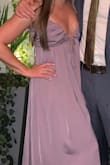 I ordered this dress last minute for a wedding.  I am usually between a S and M, so I ordered both.  The "triangle" pieces that make the bust area are oddly small, and even though I am pretty flat chested, I had to go with the size medium dress to have more "coverage area", but this meant the rest of the dress was a bit too large/loose for me.  And it still wasn't enough -- I felt like my nipples were going to be exposed all night. The strap strings are very thin, and I had to double knot them everywhere to ensure they'd stay tied during the night.  Overall I didn't love this dress, but kept it because I was in a bind and didn't have anything else to wear. - Monique G.