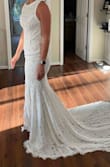 I'm very slender in the shoulders and have larger hips, therefore it was too big in the chest and too tight around my thighs. The lace, material, and train are beautiful. I decided on a different gown, so I would be more comfortable moving and sitting during my wedding day. - Kelsey G.