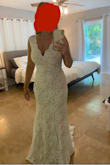 I love this dress. Wearing for my beach wedding. Classy and simple. Slight train. The neckline is amazing. - Karissa B.