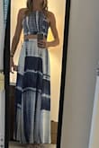 This is fun and flows beautifully. I'm tall and it almost grazed the ground with a short heel. I wore it right at my natural waist.  The top was challenging for me. My small chest didn't quite fill it out, so I sewed bust cups in to give it structure.  The top is adjustable which is a plus for making it fit any body. When this came, it was incredibly wrinkly and looked so much classier after ironing.  Also, after dancing in it all evening, I washed it on the hand wash/cold cycle and hung it to dry, but it did shrink about an inch. - Sarah N.