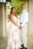 I ordered 8 dresses from various places for our small elopement and this was the only one I kept.  From the moment I put it on I knew this was the dress. It is flattering and made me feel beautiful!  I have had so many compliments on it. The bust area was snug but manageable.  Just for reference, we found a men's tie that matched the pattern perfectly! So many have asked how we made that happen but it was pure luck! We ordered it from a popular online store , just look up the Quicksand Roses pattern. - Brandi J.