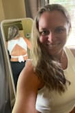 I absolutely LOVE this top.  While in the picture I had it on without a bra.  My intention is to wear it with a pretty backed bra to show it off! It is thicker on the front and top so you can wear it without a bra with the proper chest. It's not meant for larger chested!  And I couldn't wear it without a bra.  I didn't feel comfortable! - Jessica N.