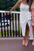 Loved this dress. Wore it for my rehearsal dinner! The slit definitely goes very high in the front so you have to be aware of that. The front is not see through, but I did wear spanx because the back was not as solid. It is comfortable and stretchy! Highly recommend - Sabrina P.