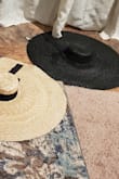 I bought this hat, along with 2 other large hats, and this one was really floppy.  The packaging made creases and I'm trying to figure out how to get them out. I got it on sale and I may just save it for a Christmas gift for Dirty Santa. It is big on my head, but it will definitely offer up some shade. Not my favorite but it will definitely be a conversation piece. - Tracy W.