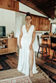 Absolutely a perfect dress. Fit great. I got petals to cover my nipples. I got a TON of compliments. Lots said it looked like a wedding dress. I felt really good in it. Felt Pretty! - Allison K.