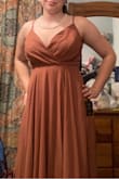 I'm a bridesmaid in a friends wedding and this dress is perfect for all of us. There's lots of layers so it's not see through just a little heavy. The inside layer is silky so it's not at all scratchy. It is very long on me so I'll need to get it hemmed but everything else fits great! - Hannah L.