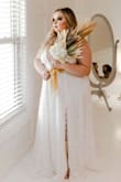 It was a lot lower cut than I thought and fit snug, but was perfect for my wedding! - Anna H.