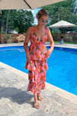 This dress is absolutely gorgeous in person! The fabric has a satin-y finish (you'll need to steam before you wear) and the colors are deep and vibrant. I removed the bottom tier of this dress to turn it from a maxi into an ankle length dress so you could see my fab shoes (also from Lulus!!). - Abby A.
