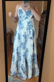 I LOVE THIS DRESS! I originally ordered a small because I read in reviews that the dress is very long, and it is! Unfortunately I was busting out of the top of the small (which my husband said was fine, of course lol). I exchanged it for a medium which fits perfectly on the top. I am fairly tall and it is definitely long, but you could hem or wear with heels. It is very comfortable and I love the swish. - Andrea G.