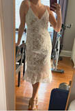 I searched for SO long to find a bridal shower dress that was cute, tasteful, but still made me feel a little sexy. This is that dress! It's super comfortable, well made and the details in the dress make the body look great! I wasn't sure if I should choose a small or medium (since my measurements were a mix of both sizes). I went with the medium and it fits great. The waist is a little loose, but I'd much rather that than look like a sausage. - Jill L.