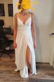 I love, love, LOVE, this dress! The top fits me perfectly, really feels like it was made for me which I haven't found in any other dress I've tried. The quality of it and the ribbing in the top make it feel like the $1000+ dresses I've tried in boutiques. The slit goes allllll the way up so I will be having a stitch or two put in so I don't flash my guests on the day. Great length for taller brides, I'm 5'8" and can wear tall heels with this as is, shorter brides will definitely need it hemmed. Hoping to get the back altered to be a low back if possible. Very happy with my purchase! - Ciara O.
