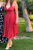 I LOVE this dress, perfect for a summer wedding (but I'm also going to wear it to a fall wedding because the color is perfect for fall). It is a little tricky to put on - I had to call in a friend to help tie it, but once you're in it felt snug and comfortable. Absolutely love the length and shape. - Emma I.