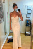 I bought this dress as a backup once we cancelled our big wedding and decided to do a smaller backyard celebration. I was convinced to wear my original designer dress for the day, but kept this one to change into for dancing and I'm glad I did! The bust was too big, so I had it altered and after that I partied all night without having to worry about pulling it up. It's much more sparkly in person that it seems in the photo, which at first I didn't love but it grew on me!  (Beware of sequins under the armpits being a little scratchy) It's quite beautiful and flattering, for the price you really can't go wrong. My only complaint is the duty I needed to pay having it shipped to Canada; it was a lot more than I thought and there was no way to get an estimate beforehand. Otherwise I'd recommend! - Kaitlin T.