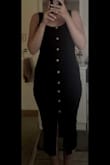 I ordered size M and like the other reviews said even though the dress has enough fabric the buttons pull apart everywhere. I really don't understand why they didn't just sew up the whole dress anyways since the buttons aren't even real. I was going to just wear a black tank and black shorts under but when sitting down, even with the black under the gaps were very noticeable. I ended up sewing the front myself and it looks perfectly fine now. I am 20 weeks pregnant (5 months), not showing much and it fits really well, there's a little extra fabric compared to other M dresses I've ordered from this website, plus the dress has stretch to it. I really could of went a size down (as long as the front was sewed up) but I like the extra room, hopefully I'll be able to wear it a lot during my pregnancy in the later months - Melody S.