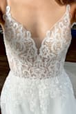 I was not expecting this dress to look good on me at all, but WOW is all I can say. I'm tall and skinny with a small chest and normally dresses with a large V neck look awful on me. I'm obsessed! SO worth the cost. Looks like a dress you would find at a bridal shop - meaning the quality is AMAZING. - Audrey N.