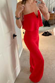 I haven't worn a lot of jumpsuits in my life, but I wore this to a wedding and received so many compliments (more than I have ever received). Based on reviews I couldn't decide if I should get a small or medium as I am typically in between sizes. I initially ordered small and it fit well everywhere but was just a little tighter than I wanted in the hips and butt, so I exchanged it for medium which worked out great. It is super long- so if you are shorter you most likely will need to get it hemmed as I did get it a little dirty on the bottom being at an outdoor wedding due to the length. However, it is beautiful and I am tempted to buy it in more colors for sure!! Order this! - Kristin M.