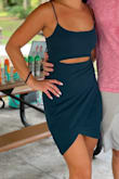 I got an XS in this and a S in a very similar dress (pink one with no cutout) and this one fit better. After a couple drinks, you could definitely see my belly, but whatever. I am a woman so it is what it is. I am a S in juniors and an XS in women's usually, so I'd say this is a true fit. Just depends on how tight you want it (it does have a good stretch to it). I didn't have any problems with it riding up and I got quite a few compliments on it. Super high quality fabric as usual with Lulus. - Kaitlyn P.