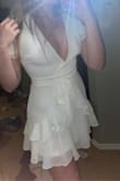 I loved this dress. It wouldn't let me put my weight in for some reason, but I'm 5'7 and about 145 lbs. I go between a small and a medium usually so I was a bit scared to get a small but mediums were sold out. Needless so say, the small fit me perfectly. I would not size down necessarily, but if you're between two sizes I would go with the smaller one. It is extremely short for someone my height which is important to note. The dress is also pretty low cut but it didn't cause me any issues. :) - Alissa P.