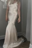 This dress is gorgeous. The fabric is double lined. It was true to size; I'm generally size 4 and ordered x-small. I recommend you wear shape wear underneath, as it will show all your curves especially in the stomach and bottom. You will likely need alterations if you want the perfect fit; that is normal for any wedding dress. There is no zipper; you have to slide it over or under your body. It can also be a little hard finding the perfect color match for accessories like veils since there are several variations of the color "champagne." Overall, I am very happy with the quality and price and quality. I plan to wear it for my wedding. - Jessica P.