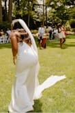 Everything about this dress was amazing! Slight stretch and perfect length. Because of the material it will show your curves so if you don't want that, BEWARE. I would recommend this dress!
I didn't take bridal portraits so I tried to upload a picture of the back and the front.
Buy it now! - Breana R.