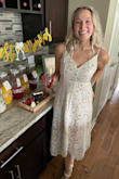 This dress was absolutely perfect for my shower. It fit almost perfectly, a tiny bit big at the top but I definitely wouldn't have ordered a smaller size. I received many compliments & was very comfy in it all day long. - Khaila P.