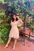 Fits like a glove. I love how the dress zips up the side so that the top is snug and form-fitting while the skirt is flowy. At the same time, I love how the tie at the bust is adjustable and perfect to tighten or loosen depending on your bust size or the bra you are wearing. The dress is a beautiful cream color with a quality lining so that you can't see through the fabric. The sleeves add a dramatic but cute flare. I wore this for graduation from nursing school and it was absolutely perfect! It was dressed up for the professional ceremony and dressed down for the after-party. I can't wait to wear it again. - Jacqueline M.