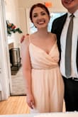 I ended up getting it hemmed (I'm 5'4") and it fit perfectly. I changed into it for my wedding reception and it was way easier to dance and move in than my wedding dress. It ended up being a little peachier than the picture but I liked the color. I paired it with a sparkly belt from Amazon and I got so many compliments! - Anne P.