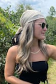 This was exactly the neutral head scarf I was looking for. It is very silky which can be hard to tie around your head at times, and slips off often. But when you get it, it is sooo cute. Can be used in so many ways to accent your outfit. Absolutely obsessed. - Lee A.