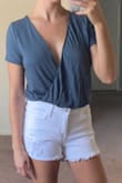 I returned this because it's very loose/open/low cut in the bust area. I feel like the girls would fall out!!! Also arrived super wrinkly. I do like the color and the fabric feels nice. - Kate R.