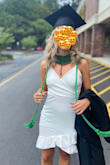 I ordered this dress in three different sizes for my recent graduation and ended up wearing the S. It fit beautifully but it is form fitting so I wore Spanx underneath to keep my belly more contained. If you don't want it so tight maybe get a larger size. Well made material, and just a pretty dress overall! Received many compliments and I loved it! Heads up it can ride up a little bit in the front so if you have super long legs I don't know if it will work as well. - Sloane M.