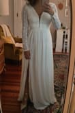This dress is really lovely! I LOVE the skirt with the slit; the silhouette is really flattering. The whole dress is quite comfortable. I didn't care so much for the very deep V or all the straight lines in the pattern of the lace, but as a whole, the dress is nice. - Carolyn C.