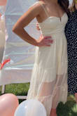 I'm so happy I ordered this one! My initial reaction was that the material and construction felt kind of cheap, but it help up very well. I might buy it in black too!
It was very flattering, a perfect length for me, and I loved the tie straps which are so trendy right now. Definitely giving off major garden party vibes with this one! - Kaylie K.