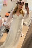 I ordered this dress for my upcoming 5 year vow renewal in the mountains with my husband and it is everything I could have ever wanted. It is so stunning in person, pictures do not do it justice. The quality is amazing and the bust even has gel grip strips so it won't slip or move around. It has big beautiful balloon sleeves so keep that in mind if you don't like that look! It even came with a dress bag. It is too long on me but I am just barely over 5 feet tall so that was a given. It definitely runs large, I usually am a large in tops and I definitely could have gotten a medium, but I will just have it taken in when I get it altered. I cannot wait to wear this on our special day, if you're thinking about getting this- do it!!! - Jennifer B.
